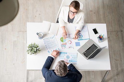 Analytical expert explaining statistics to businessman