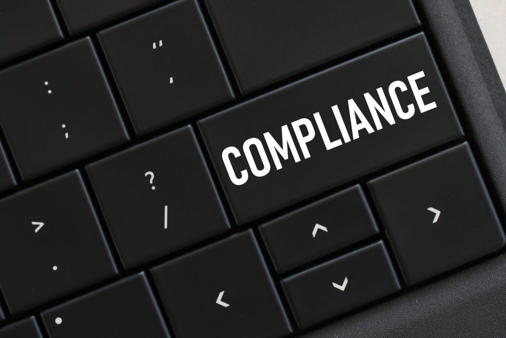 computer-keyboard-with-a-compliance-button-concept-8PNSTAU