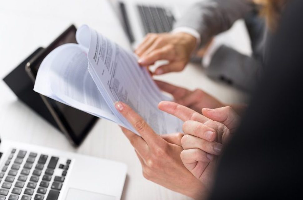 Business Women Work With Documents In Creative Modern Office, Two Businesswoman Teamwork Female Discussing Paper Or File Report Planning Project Together Sitting At Desk