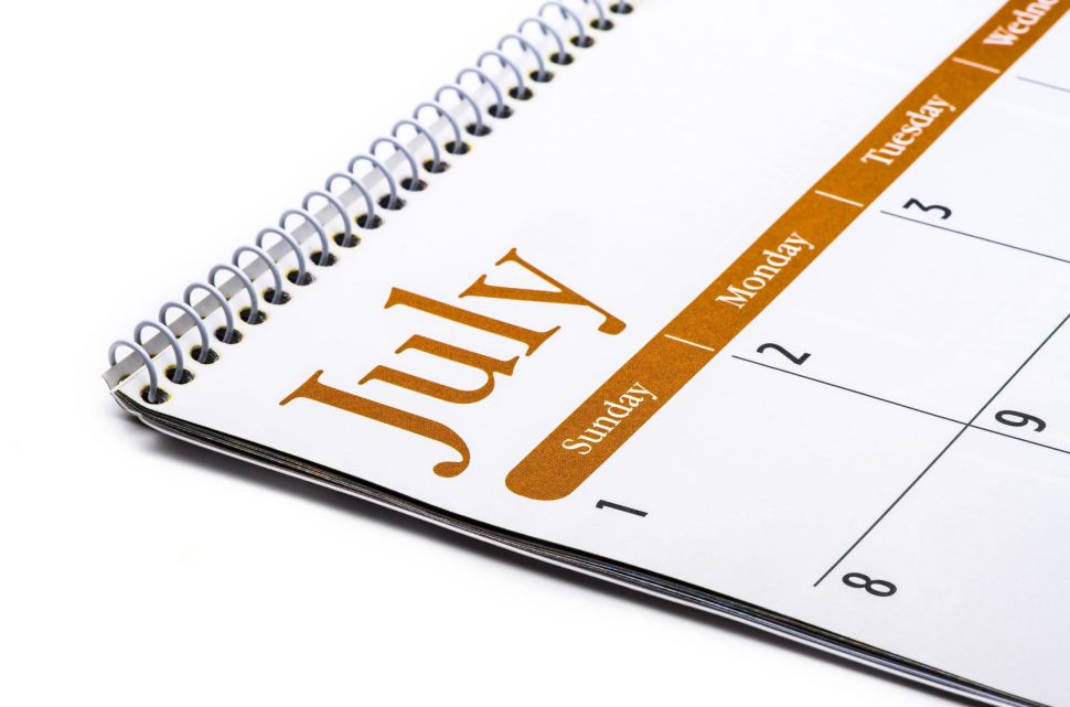 Desk top calendar July close up on a white background